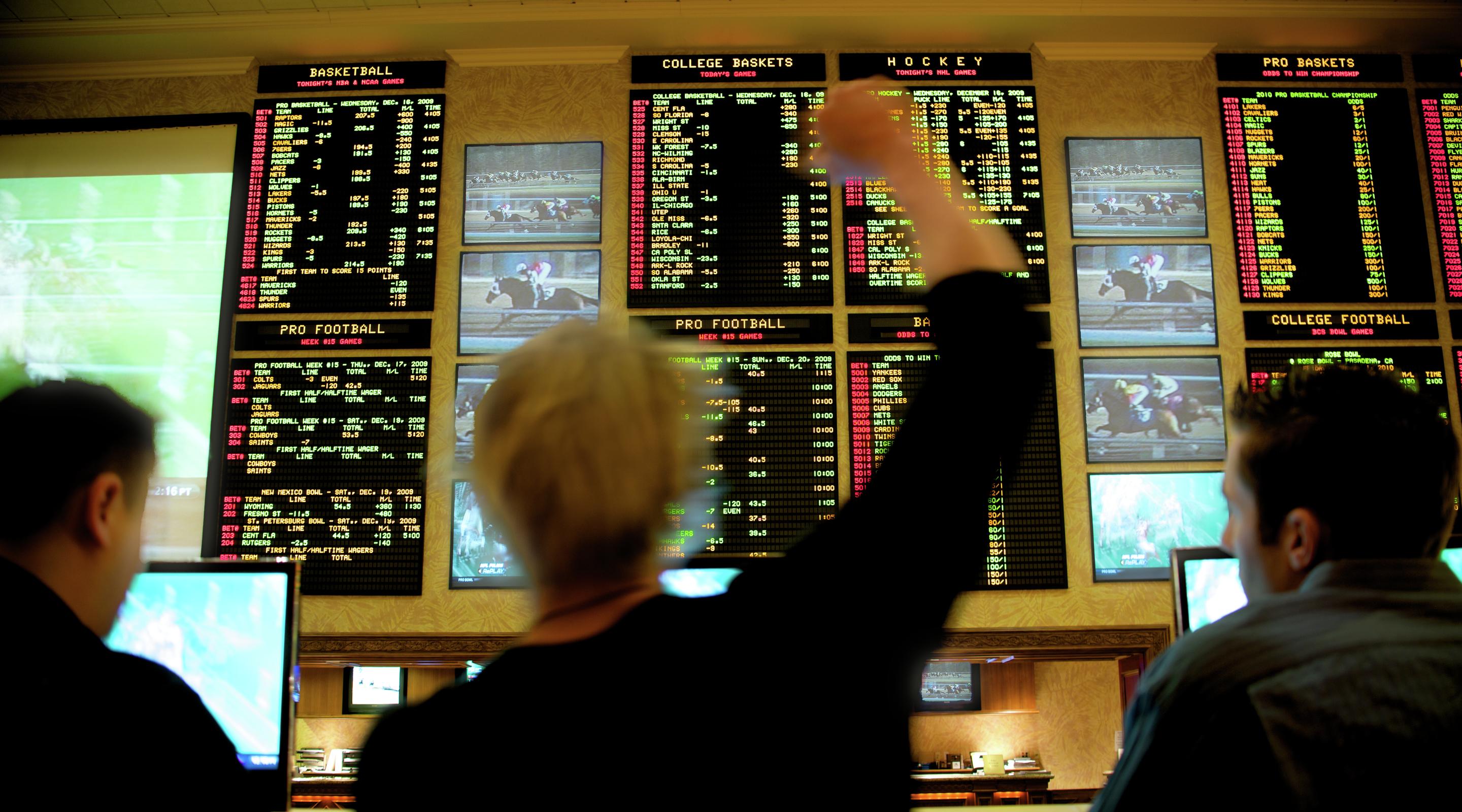 A guest cheers as he wins big at the sports book.