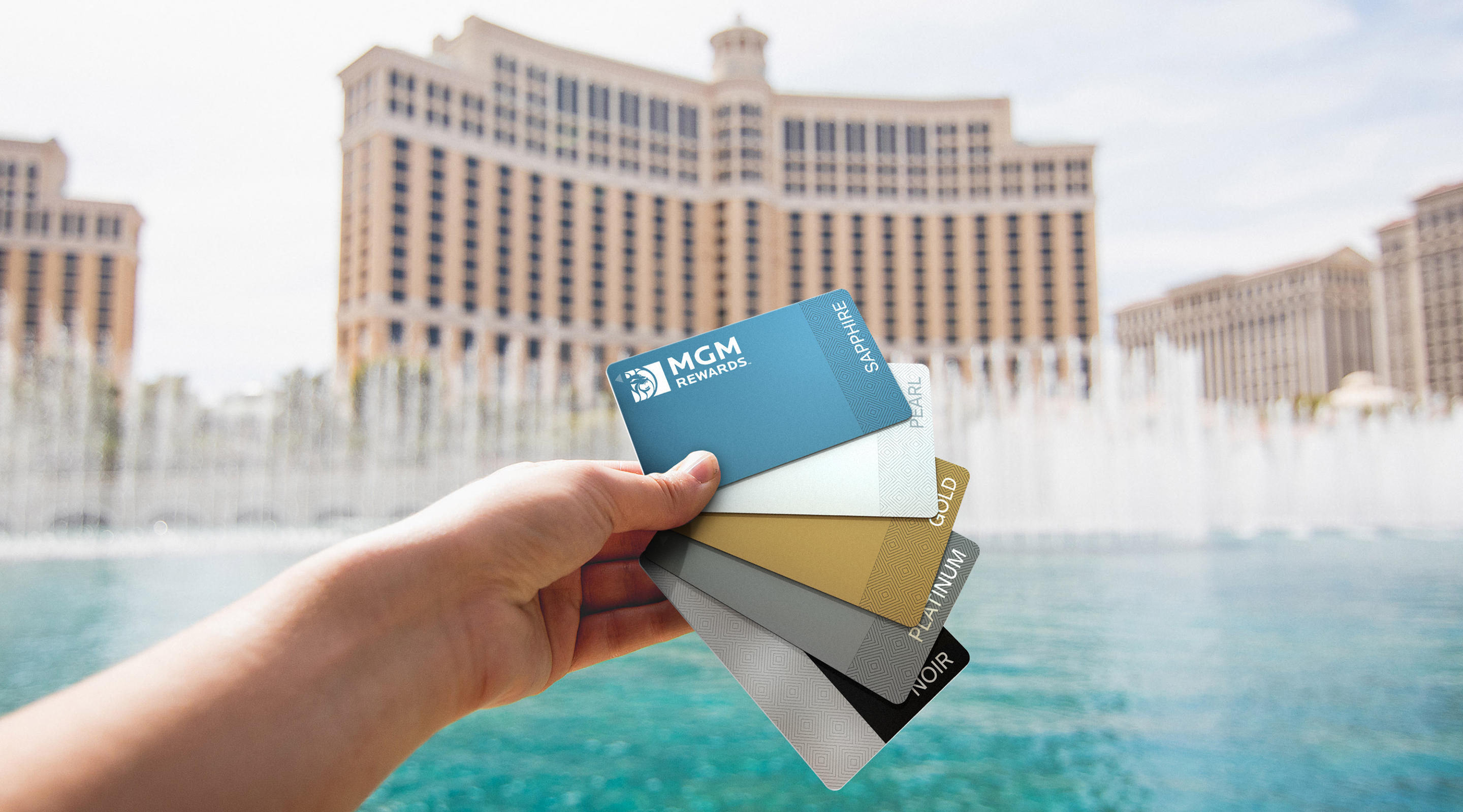MGM Rewards Cards with Fountains of Bellagio in the background